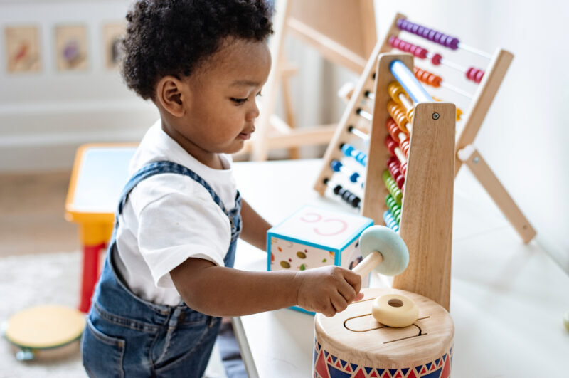 Young,Boy,Playing,With,Educational,Toys